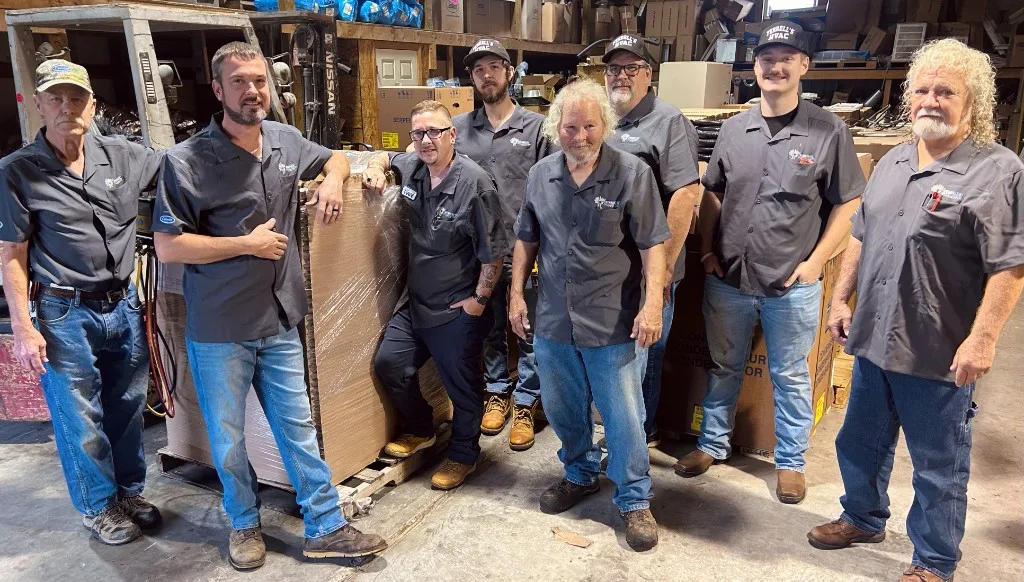 The Ferrell's HVAC team in the shop with a new Carrier system
