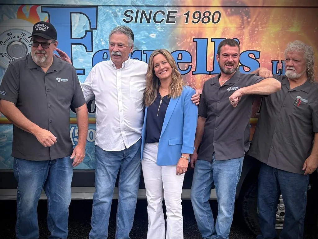 Ferrell's owner Kerri Finke with founder Kenneth Ferrell and the team
